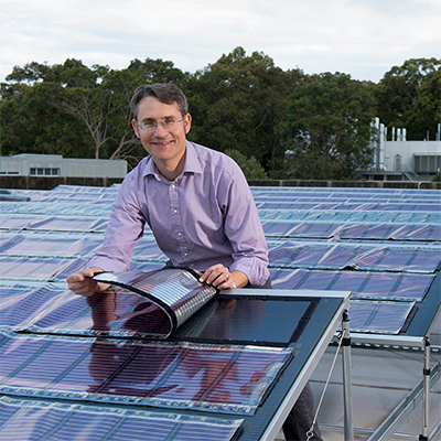 University of Newcastle professor Paul Dastoor checks the printed solar panels that transformed the Chep factory.