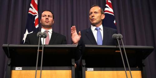 Secretary to the Prime Minister, Josh Frydenberg (left) and Prime Minister Tony Abbott outline the 'cutting red tape' program.