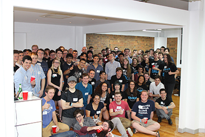 Participants celebrate a successful 2016 Tanda Hackathon.